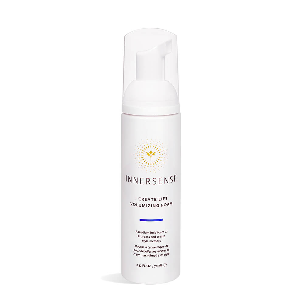 A bottle of innersense i create lift volumizing foam on a white background.
