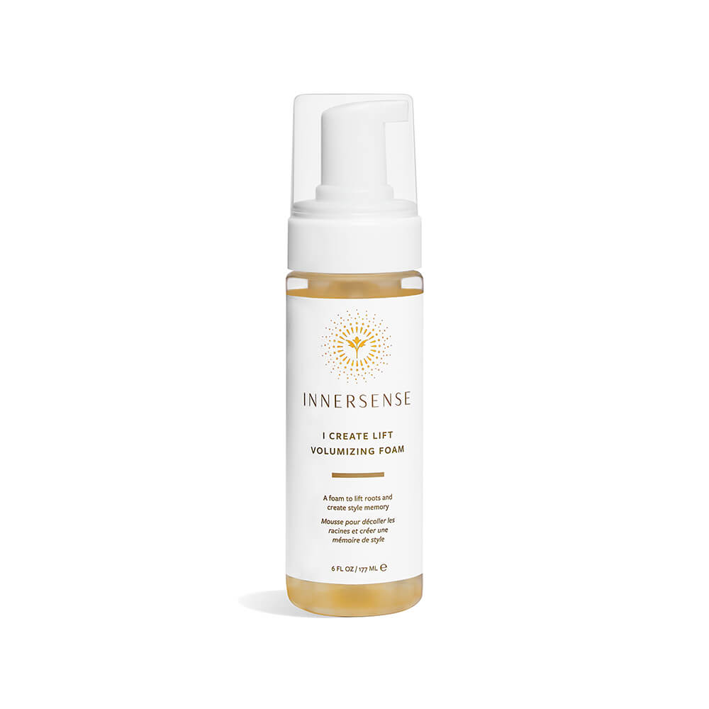 Bottle of innersense organic beauty - i create lift volumizing foam against a white background.