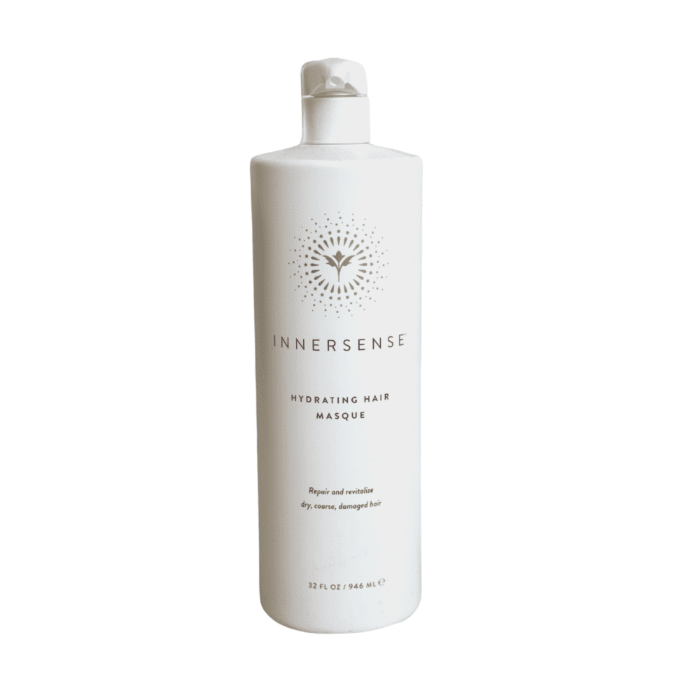 White bottle of innersense hydrating hair masque against a plain background.